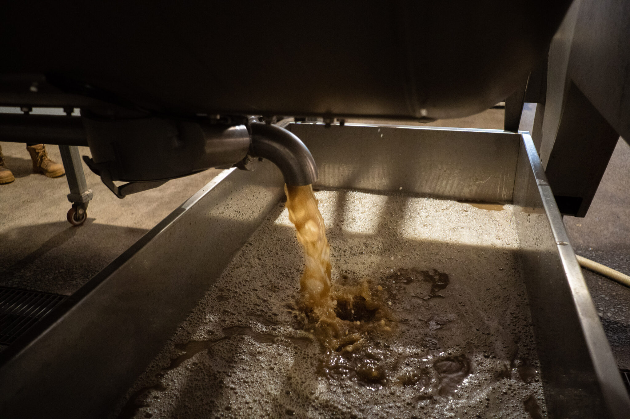 Liquid being poured during the wine-making process