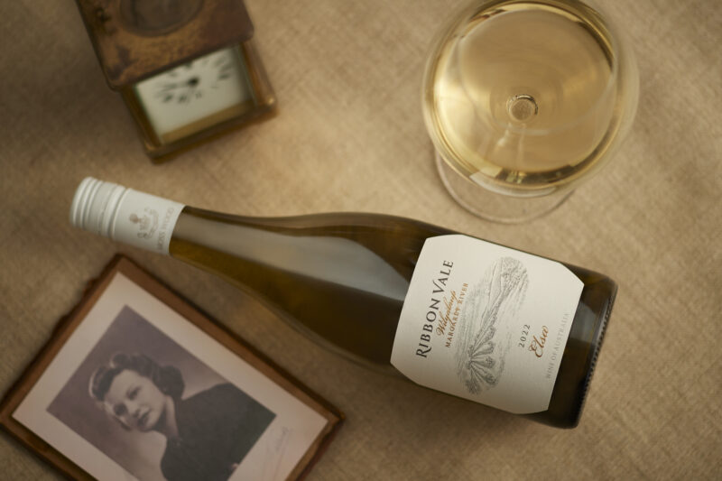 01_20230131_MOSS WOOD_Creatives_Elsa 2022_Horizontal A bottle of Ribbon Vale wine laying on a table