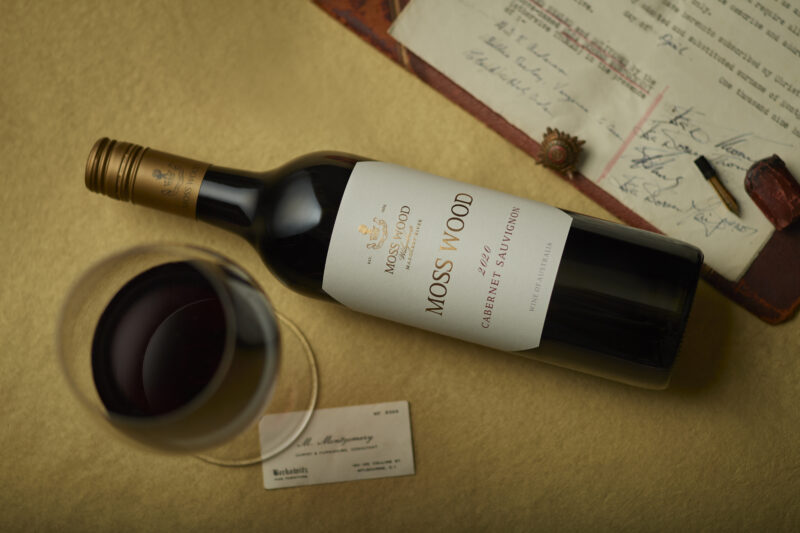 20221114_MOSS WOOD_Creative_2020 Cabernet Sauvignon hori A bottle of Moss Wood Cabernet Sauvignon wine laying on a table
