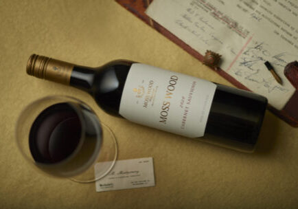 A bottle of Moss Wood Cabernet Sauvignon wine laying on a table